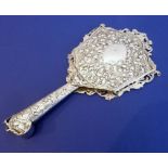 A very heavy and extremely ornate Victorian hand mirror, hallmark for 1884
