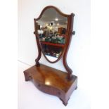 A late 18th century George III period serpentine-fronted mahogany and rosewood crossbanded toilet