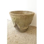 A single circular, verdigrised stoneware garden planter adorned with swags in the neo-classical