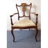 An elaborate Edwardian mahogany and bone-strung oak armchair; the top and crest rails decorated with