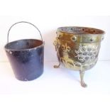 An early 20th century circular brass coal bucket with two lion mask and ring handles