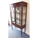 An Edwardian period mahogany, satinwood crossbanded and boxwood-strung display cabinet; two glazed