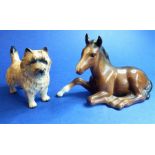 A Beswick Cairn terrier and a recumbent Beswick foal (2)
