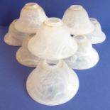 Nine bell-shaped alabaster-style glass light shades