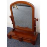 A 19th century mahogany toilet mirror having two drawers to the frieze, raised on bun-style feet,