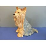 A Beswick fireside Yorkshire Terrier with red bow (26cm high, 24cm widest at the bottom)