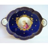 A late 19th/early 20th century Sèvres-style two-handled porcelain serving tray centrally decorated