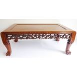 An early 20th century Chinese burr-oak-topped hardwood rectangular occasional table; the pierced