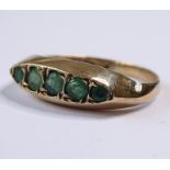 A 9-carat gold ring set with five graduated emeralds (The cost of UK postage via Royal Mail