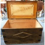 A large iron-mounted scumble-finish pine chest with two side carrying handles, the hinged lid