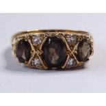 A 9-carat gold, smoky quartz and diamond dress ring, ring size N (The cost of UK postage via Royal