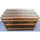 A good-quality early 20th century travelling trunk; leather-bound and metal-mounted, one leather