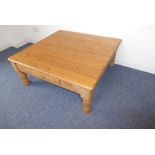 A low pine coffee table with single end drawer (110cm x 109cm)