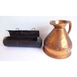 A 19th century copper one-gallon jug and an interesting toleware wall-hanging circular candle box;
