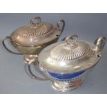 A pair of early 20th century boat-shaped, sliver plated entrée dishes with lobed lid in late Neo-