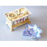 A 19th century porcelain desk stand, the removal sander and inkwell above vignettes of Chinese