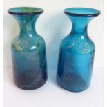 A pair of Mdina glass carafes; both predominately blue with trailing mustard/speckle decoration (