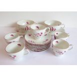 A hand-decorated Chantilly part tea service comprising two large cups and saucers, six smaller