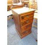 An early 20th century four-drawer walnut chest of slim proportions; galleried back above four full-