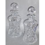A pair of heavy cut crystal decanters of waisted form, each with star-cut base (29cm high)