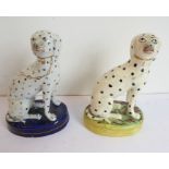 Two 19th century Staffordshire porcelain models of seated Dalmations (each approx. 12.5cm high)