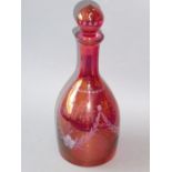 A 19th century mallet-shaped cranberry glass decanter etched with floral swags etc.(27cm high)