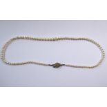 A good graduated pearl necklace on stone-set clasp (The cost of UK postage via Royal Mail Special