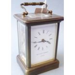A brass and glass-sided carriage clock by Matthew Norman (London), the gilded movement signed and