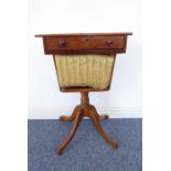 A 19th century mahogany work table with single frieze drawer and wool slide below raised on four