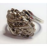 A white-metal (marked 14K) ring set with small white stones, ring size M/N (The cost of UK postage