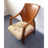 An interesting early 20th century oak Arts and Crafts style chair; leather back and floral