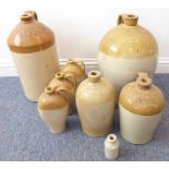 Eight stoneware flagons; some named - W Gazey, Parsons Street, Banbury; Heritage & Bennett,