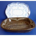 A late 19th / early 20th century oval slipware dish with trailing style decoration  (large