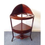 A George III bow-fronted mahogany washstand with galleried top and single central drawer together