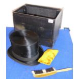 A boxed silk top hat together with hat brush and foam rest; the hat box with the label of Dunn & Co,