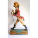 An original Johnnie Walker Scotch Whisky plaster advertising model upon a wooden plinth base