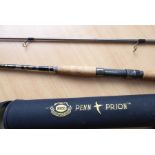 An unused 10-ft Penn 'Prion' two-piece spinning rod, 10-20lb line, 160cm tube cased