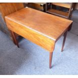 A early 19th century mahogany Pembroke table, single end-drawer raised on square tapering legs