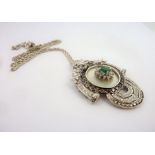 An 18-carat white-gold pendant set with champagne diamonds, white diamonds and emerald (total weight