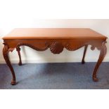 A William Kent-style centre mahogany library table; the thumbnail-moulded top above swags and