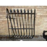A black-painted iron gate (123cm high x 96cm wide)