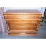 A late 19th century French rouge-marble-topped walnut commode, four full-width drawers flanked by