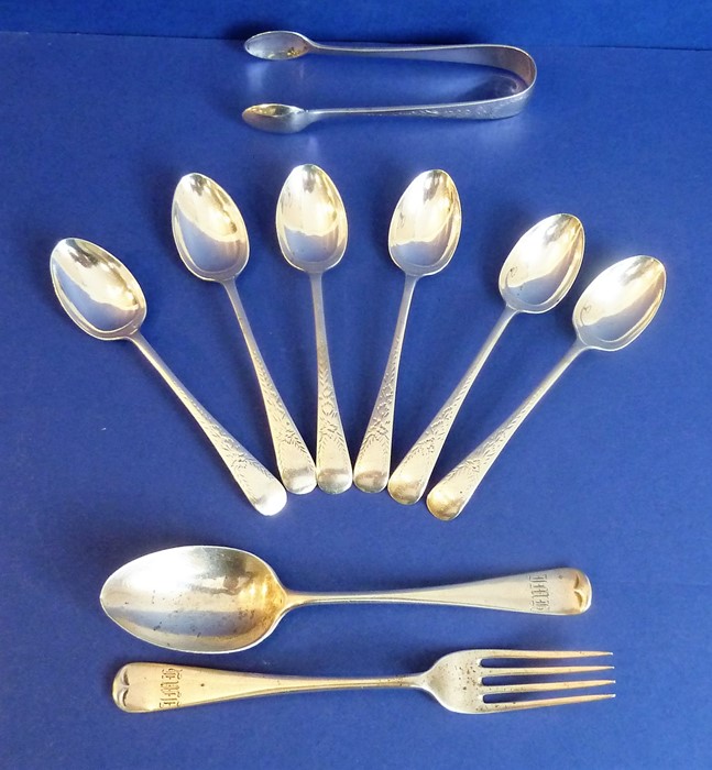 A set of six hallmarked silver teaspoons with bright-cut engraving, one further larger teaspoon, a