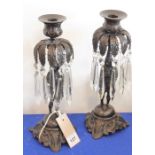 A good pair of probably early 20th century figural bronze candlesticks; each with hand-cut clear-