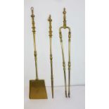 A large and heavy early 20th century brass fire-side set: shovel, tongs and poker