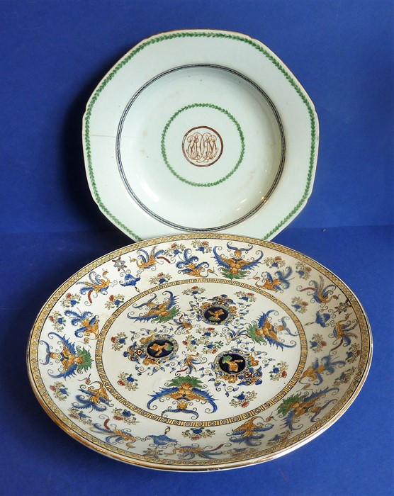 An 18th century Chinese octagonal porcelain dish centred with a monogram and surrounded by a green