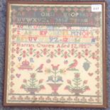 A mid-19th century needlework sampler depicting urns, birds, a royal cypher, letters and numbers