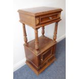 An early 20th century French rouge-marble-topped walnut pot cupboard, single frieze drawer above and