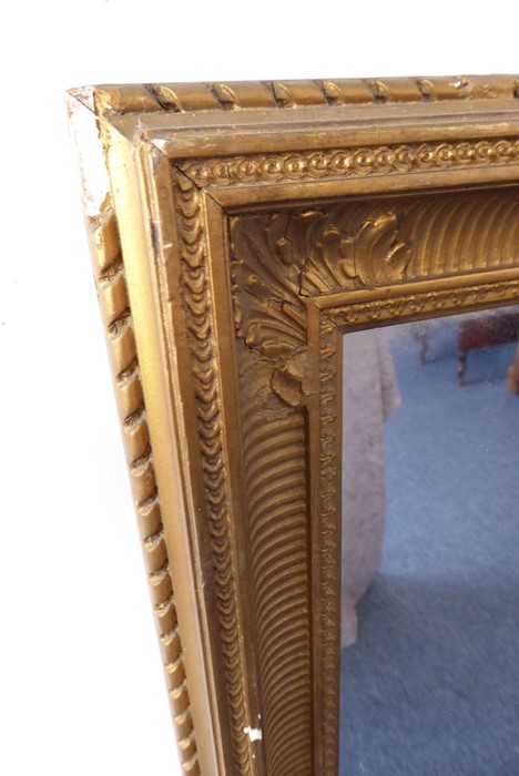 A gilt-framed wall-hanging mirror; the corners of the frame decorated in relief with acanthus leaves - Image 2 of 2
