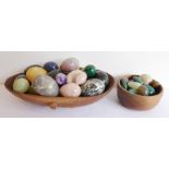 A selection of hand-polished hardstone decorative eggs to include malachite, onyx and alabaster (